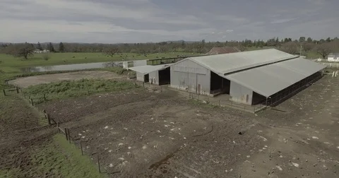 Close up pan around farm and lake. Stock Footage 75763042