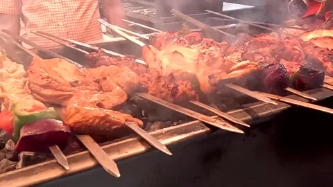 Close Up Pan Of Chicken Tikka And Seekh Kebab Grilling On BBQ 動画素材 342177073