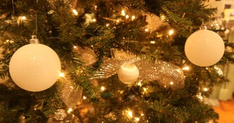 Close-up Pan of a Christmas Tree with White and Gold Ornaments Stock Footage