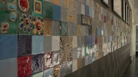Close-Up Pan of Decorative Ceramic Tile Wall with Golden Details Stock Footage 338244188