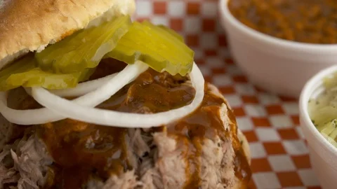 Close up pan down of BBQ pork sandwich  動画素材 112575740