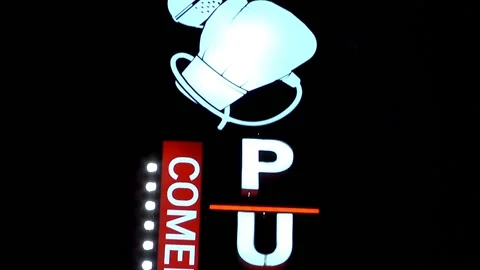 Close Up Pan Down of Punchline Comedy Club Sign Night Video stock 170468152