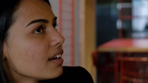 Close up pan from face of one smart suave sophisticated Asian businesswoman to a Stock Footage 102548253