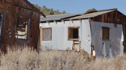Close Up Pan of Ghost Town Cabins in Nevada Desert - Shallow DOF Stock Footage 144733357