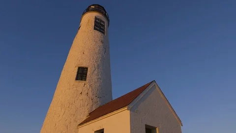 Close Up, Pan High Tilt of Great Point Lighthouse during Sunset, Nantucket Stock Footage 87990894