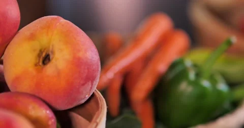 Close-up pan from left to right of assorted fruits and vegetables. Stock Footage 138332570