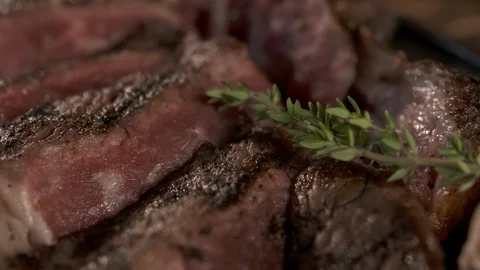 Close up pan left of sliced steak  Stock Footage 112576045