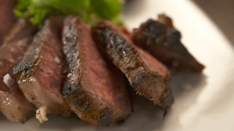 Close up pan left of steak  Stock Footage 112660473