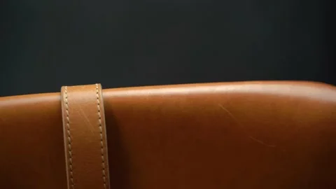 Close up pan movement of leather bag, cinematic light Видео 146260247