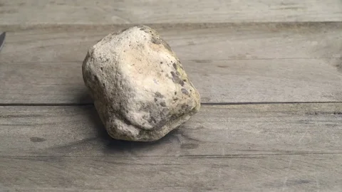 Close up pan movement of Rock, Paper and Scissors over wooden table Stock Footage 71642060