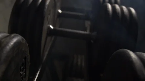 Close Up Pan Over The Top Of Weights Lined Up On Weight Rack In Industrial Gym Stock Footage 123064062