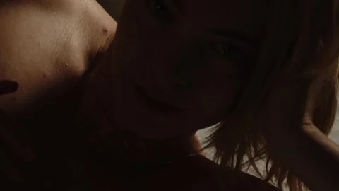 Close pan over the topless body of an attractive young woman Stock Footage 270732259