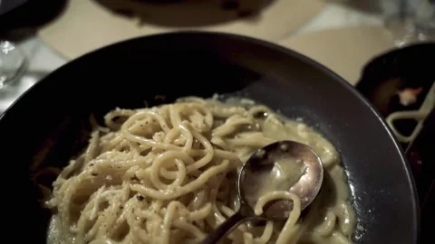 Close up Pan of Pasta with cheese spoon in bowl Manhattan 4k Stock Footage 255755575