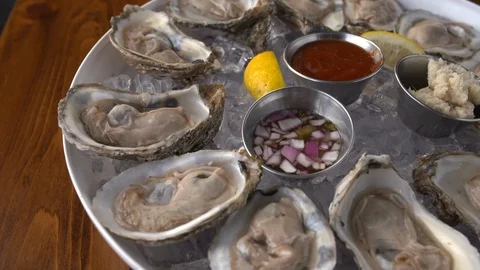 Close up pan of raw oysters  Stock Footage 112575701