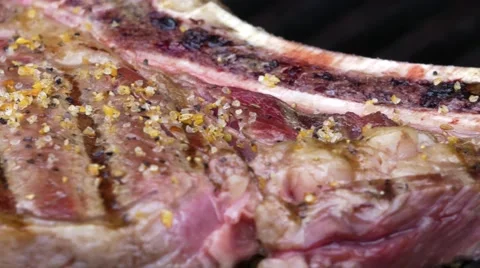 Close Up Pan of Rib Eye Steak Cooking with Grillmarks 4K Stock Footage 65447903