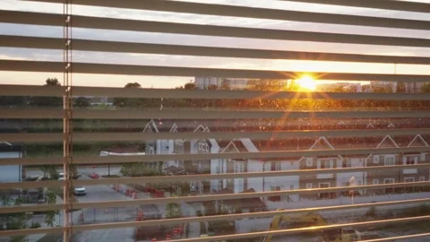 Close-Up Pan Shot of Blinds with Sunset View Outside Stock Footage 242976868