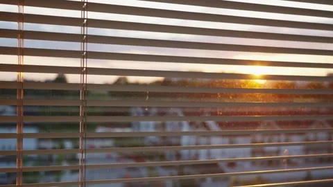 Close-Up Pan Shot of Blinds with Sunset View Outside Stock Footage 242976906