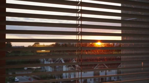 Close-Up Pan Shot of Blinds with Sunset View Outside Stock Footage 242976926