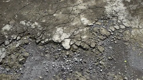 Close up pan shot of damaged concrete road Stock Footage 336589660