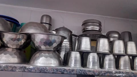 A close-up pan shot of everyday cookware and utensils arranged decoratively.. Stock Footage 314639804