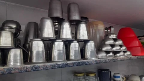 A close-up pan shot of everyday cookware and utensils arranged decoratively.. 스톡 동영상 314640074