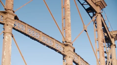 Close up pan shot of a large ornate rusting Victorian gas holder at gasworks in Video stock 128914570