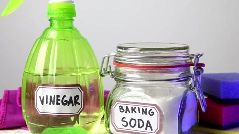 Close up pan of white vinegar and baking soda cleaners. Stock Footage