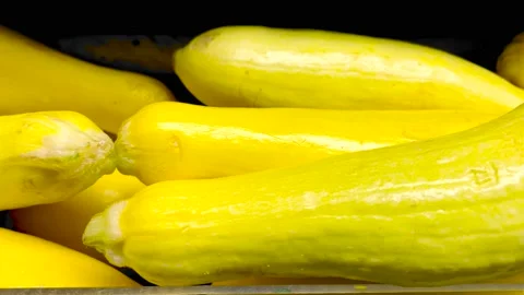 Close up pan Yellow squash and glass rail in a retail grocery store Stock Footage 179216617