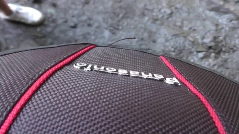 Close-up of Panasonic camera case with people walking past Video stock 92576280