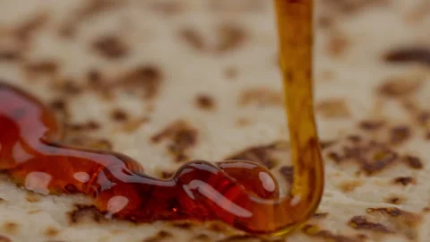 Close up of pancake with pouring syrup rotating food background Stock Footage 261715969
