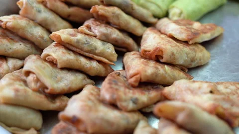 Close-up of pancakes in a triangular shape stuffed with meat. Delicious and high Stock Footage 165748949