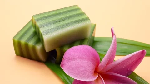 Close Up Pandan Layer Cake On Yellow Background. Stockbeeldmateriaal 194989149