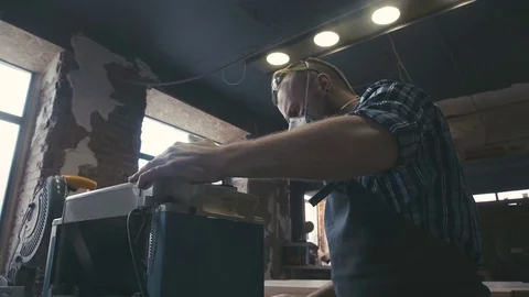Close-up: panel saw in the carpentry workshop. Electric jig saw Stock Footage 72728315