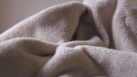Close up, panning and shallow depth of field of of beige bathrobe texture Stock Footage 118597554