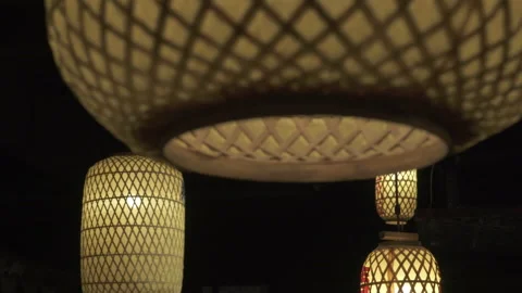 Close-up Panning: Illuminated yellow lanterns with Chinese script - Suzhou, Chin Stock Footage 149677024