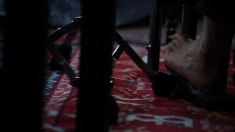 Close up panning shot of drum kit foot pedals being played on red rug Stock-Footage 98757584