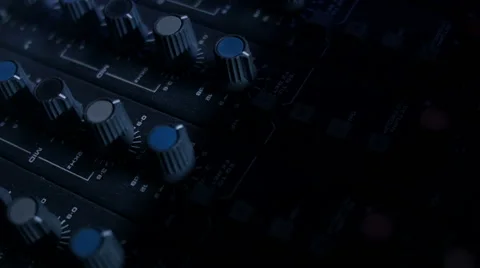 Close-up panning shot of EQ Knobs on a mixing console desk. Video stock 52056545