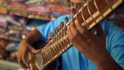 Close Up Panning Shot of a Man Playing a Sitar. High quality video footage Stock Footage 167554778