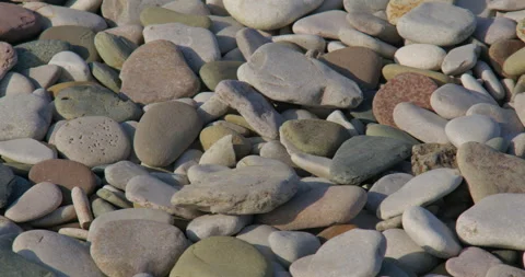Close-up Panning shot of Pebbles on the beach at pensarn, north Wales 動画素材 346191521