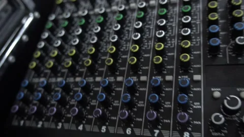 Close-up panning shot of an professional audio mixing console showing vario.. 库存影片 340867645