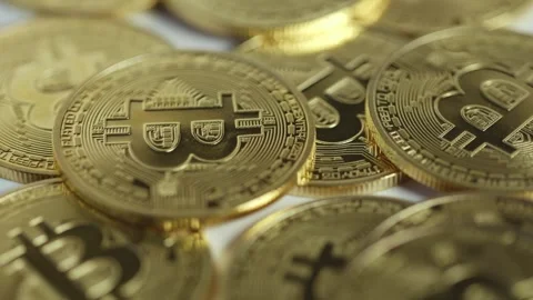 Close-up panning view, Bitcoin symbolic logo, alternative money Stock Footage 296582786