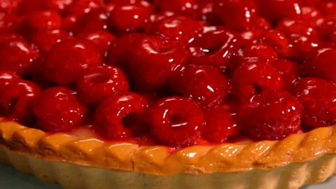 Close-up panorama of a delicious Fresh raspberry jelly-covered pie Stock Footage 146457514