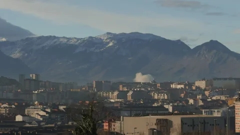 Close panoramic view of Oviedo rooftops and snowy mountains Video stock 338029248