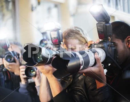 Close up of paparazzi photographers pointing cameras at event Stock Photos
