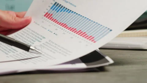 Close-up of paper blank loan repayment calculation.Mortgage payment sheet Stock Footage 261064335
