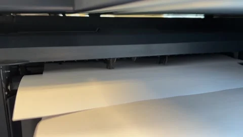 Close up of paper sheets being printed out and piled up Stock Footage 325508416