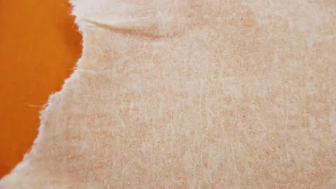 Close up on a paper tape. Packaging paper tape is used to seal cardboard box 스톡 동영상 165094850