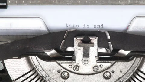 Close up paper with typed text THIS IS END being pulled out of typewriter Stock Footage 185135666