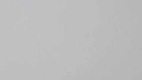 Close up on paperclips falling onto a white surface Stock Footage 117349751