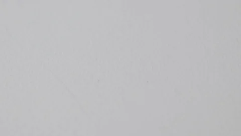 Close up on paperclips falling onto a white surface in various group sizes Stock Footage 117349832